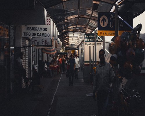 A modern and crowded public transportation station in Mexico City with stairs
